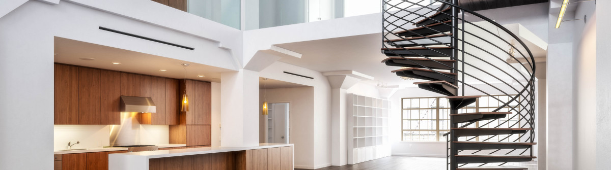 empty-room-of-residence-with-a-spiral-staircase-shutterstock_154341227-2-1200×335