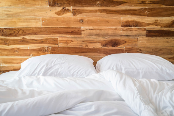 Close up white bedding sheets and pillow, Messy bed concept